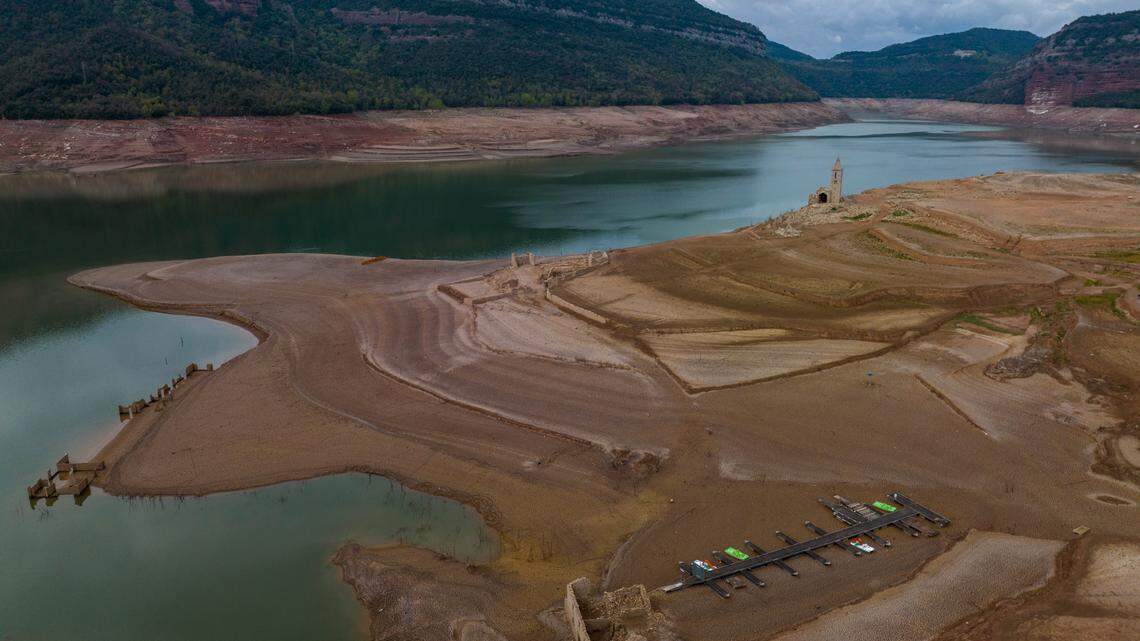 The Church of Sant Romà de Sau is usually underwater in Catalonia reservoir, but dry conditions exposed the ruins as a drought warning sign.