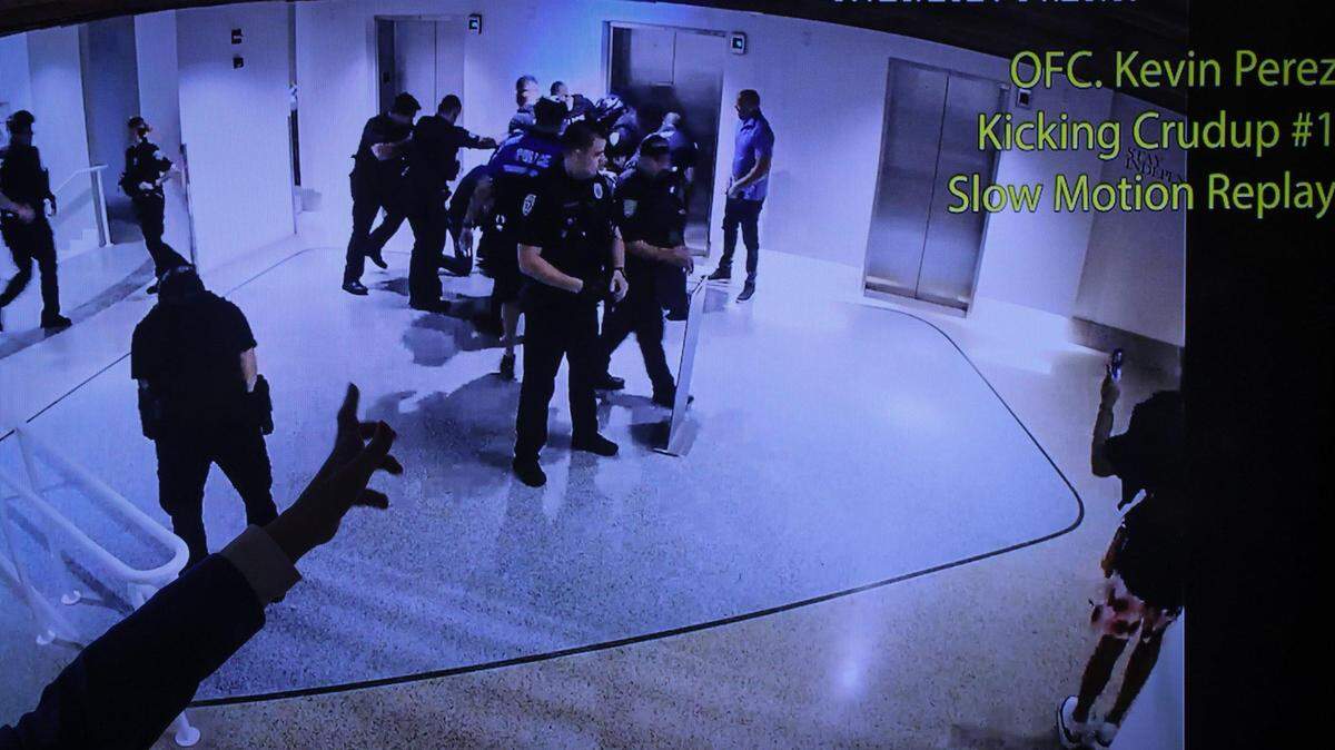 State Attorney Katherine Fernandez Rundle points to the video where a police officer allegedly kicks defendant after announcing the arrest of Miami Beach police officers and shared the video involved with a rough arrest last week at the Miami-Dade State Attorneys Office on Monday, August 2, 2021.