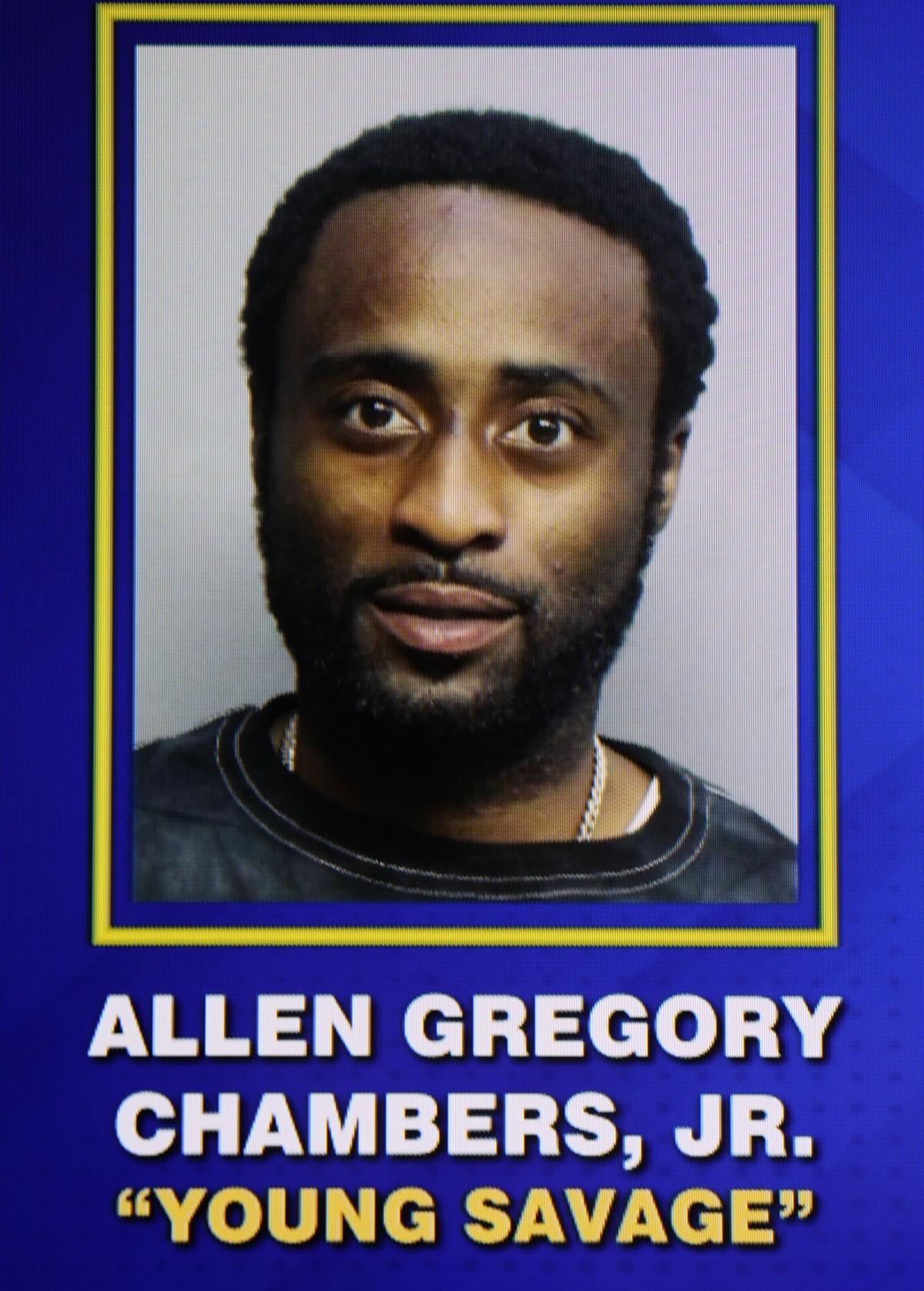 A photo of Allen Gregory Chambers, Jr. is displayed on the screen after he was arrested as one of four individuals linked to the mass shooting at El Lula Banquet Hall on Thursday, June 13, 2024, in Miami, Florida. These arrests come three years after the tragic El Mula Banquet Hall shooting on Memorial Day 2021, which resulted in three fatalities and 20 injuries.
