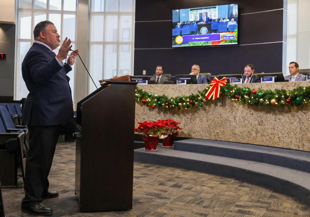 Attorney Michael Pizzi, left, hired by the Vice Mayor, addresses the Doral City Council regarding the referendum limiting the office of the Vice Mayor Maureen Porras expenditures as being unlawful. The City of Doral held a special council meeting regarding the resolution establishing the limitations on rotating vice mayor position after heated debate the measure passed 3-2, but Vice Mayor Maureen Porras filed a lawsuit in court on Wednesday, December 18, 2024.