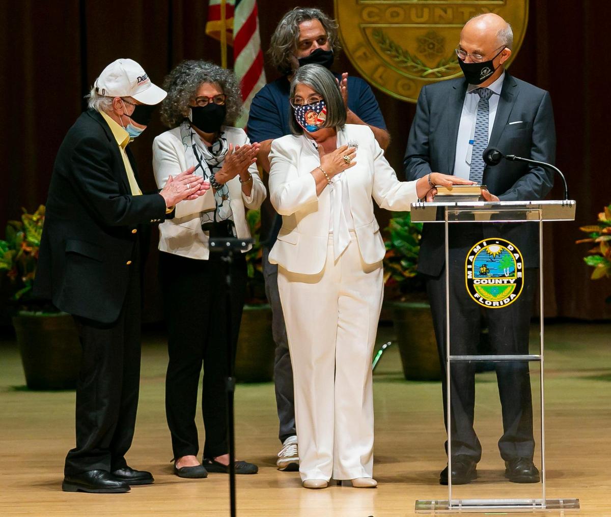 Miami-Dade Mayor Daniella Levine Cava, center, is congratulated by her family after being sworn into office by Judge Roy K. Altman inside the Knight Concert Hall at the Adrienne Arsht Center for the Performing Arts in downtown Miami on Nov. 17, 2020.