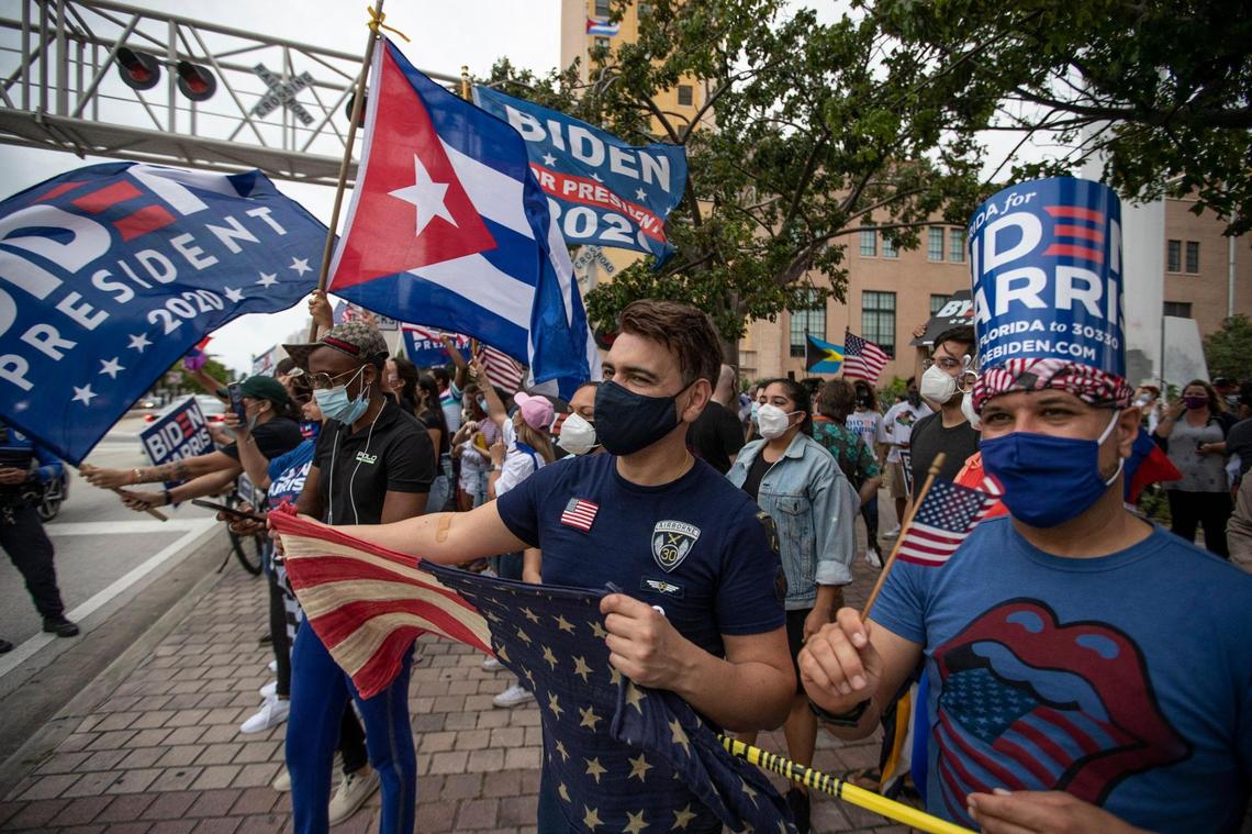 Celebrations break out along Biscayne Blvd in downtown Miami after Joe Biden wins the presidency over President Trump on Saturday, November 7, 2020.