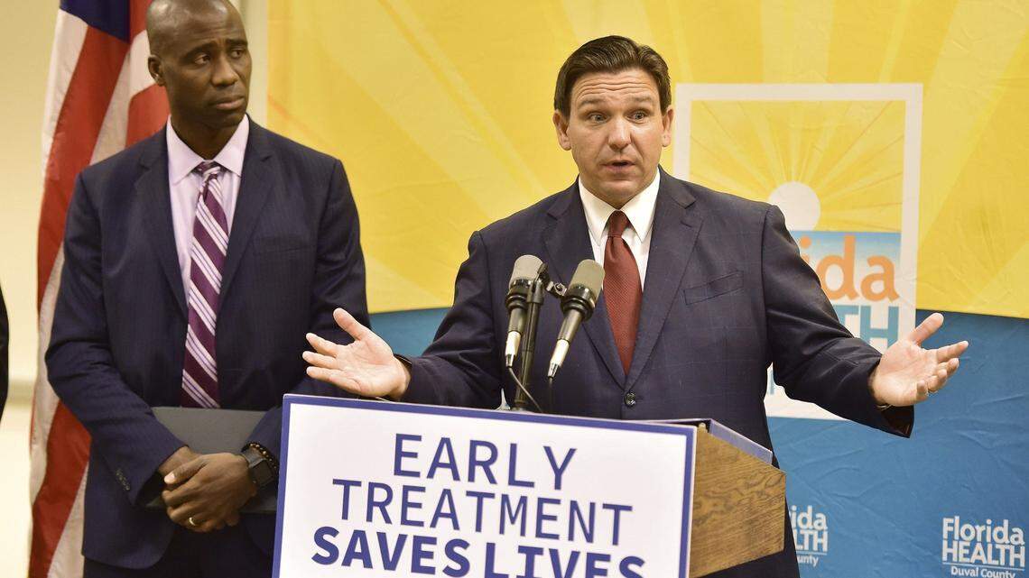 Florida Gov. Ron DeSantis, seen with Dr. Joseph Ladapo, Florida’s surgeon general, addresses a question during a 2022 Jacksonville news conference to discuss COVID-19 testing policy and monoclonal antibody treatment availability.