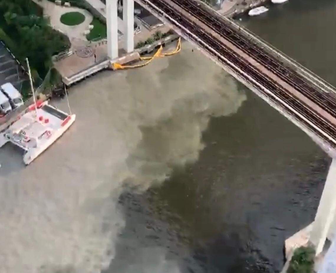 A silt plume is seen in the Miami River in August after a contractor allowed sediment to enter into a nearby storm drain. Because the turbidity curtain was not properly attached, the plume washed straight into the river.