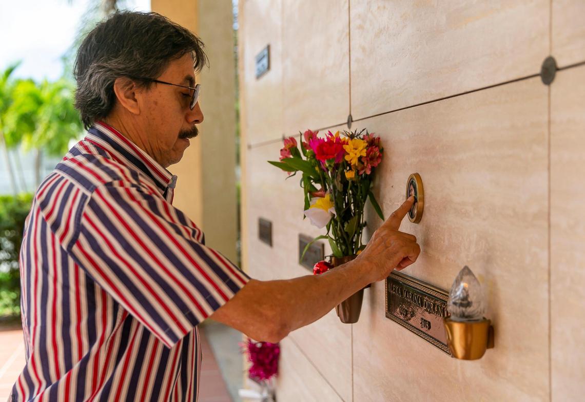 Orlando Duran, the father of Alexa Duran, touches a photo of his daughter at her mausoleum in Vista Memorial Gardens in Miami Lakes, Florida, on Sunday, March 13, 2022. Alexa Duran is one of six victims who were killed outside of Florida International University when a pedestrian bridge, still underway, collapsed on March 15, 2018.