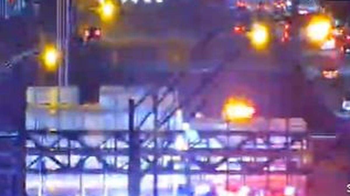Emergency vehicles block the northbound lanes of I-95, south of I-195, Friday night.