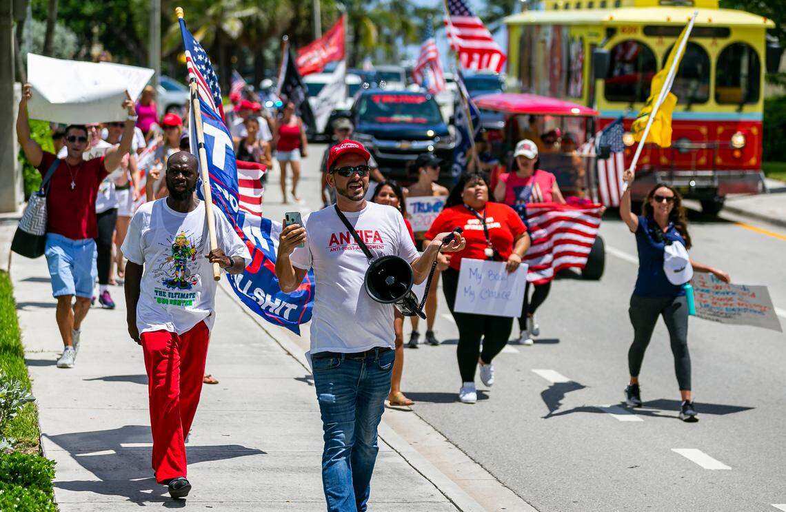 Chris Nelson, bottom-center, participates in an ÒEnd Of The Pandemic March South FloridaÓ rally in Las Olas Beach in Fort Lauderdale, Florida on Saturday, August 15, 2020.