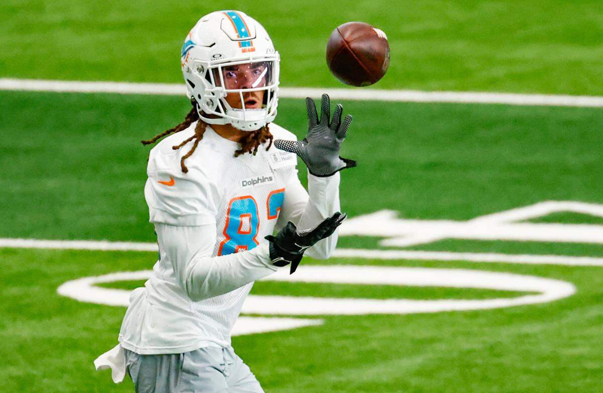 Miami Dolphins wide receiver Chase Claypool (83) catches a pass during practice drills at the Baptist Health Training Complex in Miami Gardens on Wednesday, October 11, 2023.