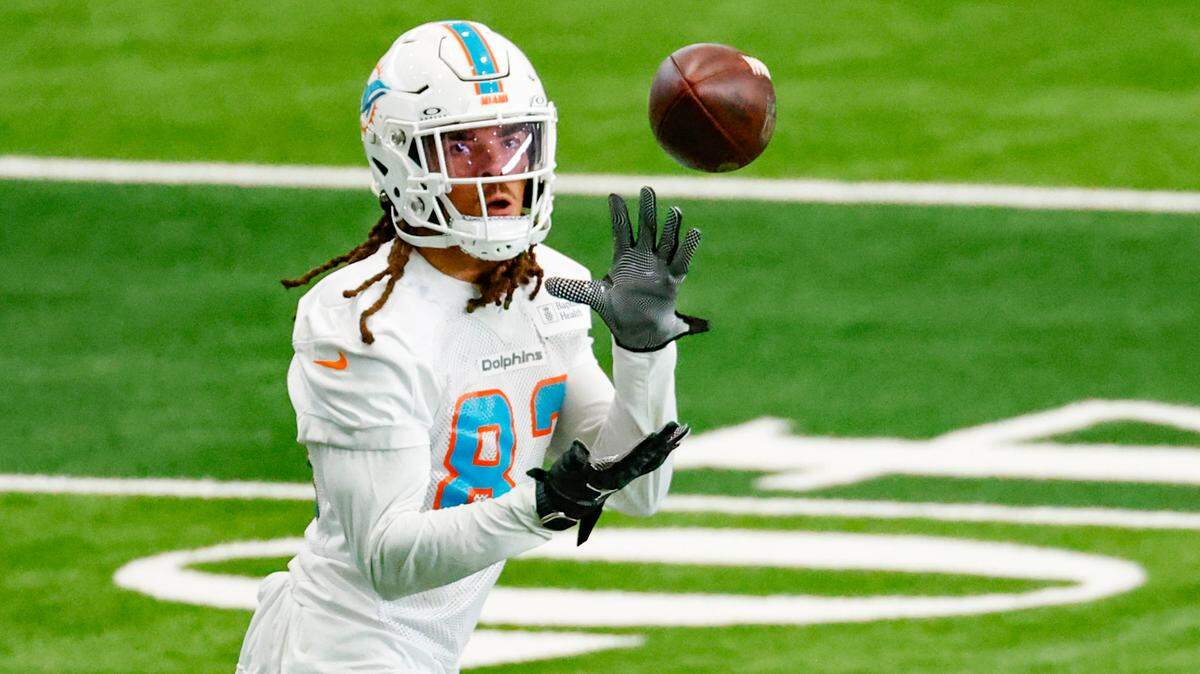 Miami Dolphins wide receiver Chase Claypool (83) catches a pass during practice drills at the Baptist Health Training Complex in Miami Gardens on Wednesday, October 11, 2023.