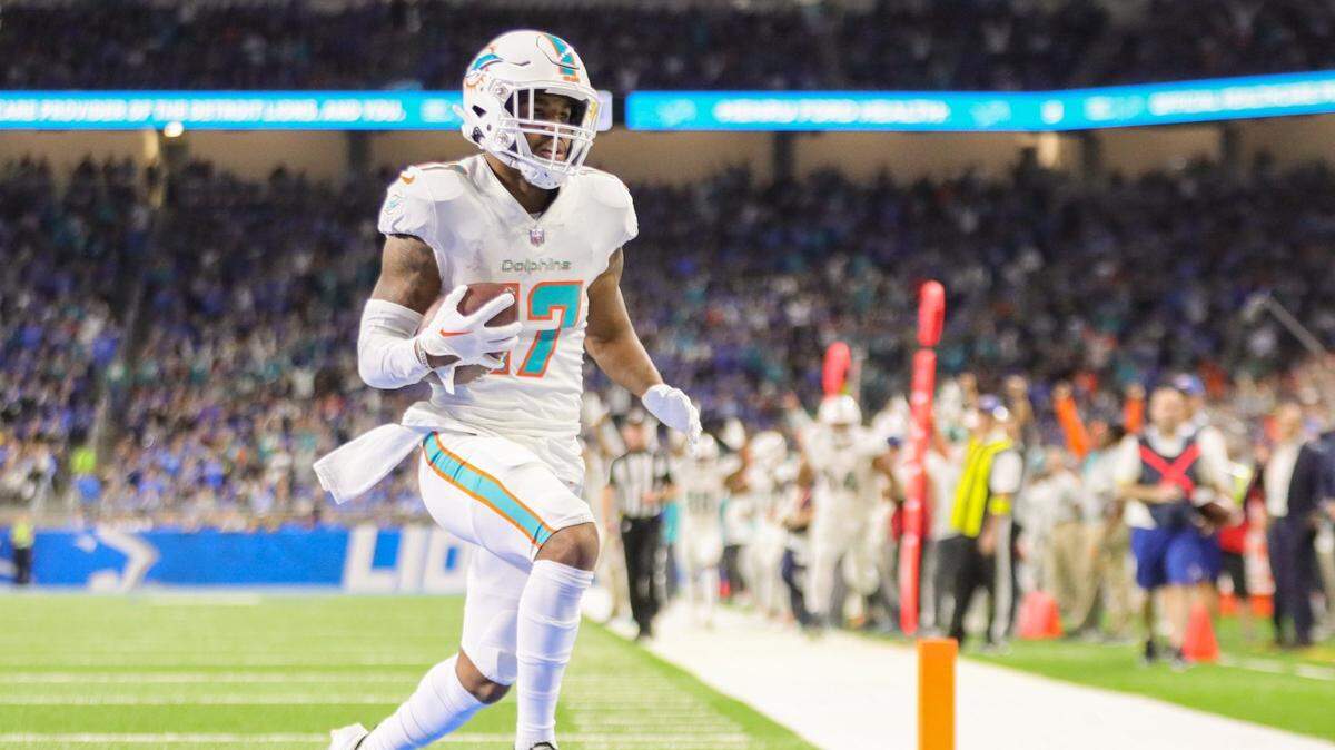 Miami Dolphins wide receiver Jaylen Waddle (17) catches a touchdown pass as Detroit Lions cornerback AJ Parker (41) defends in the second quarter at Ford Field in Detroit, Michigan on Sunday, October 30, 2022.