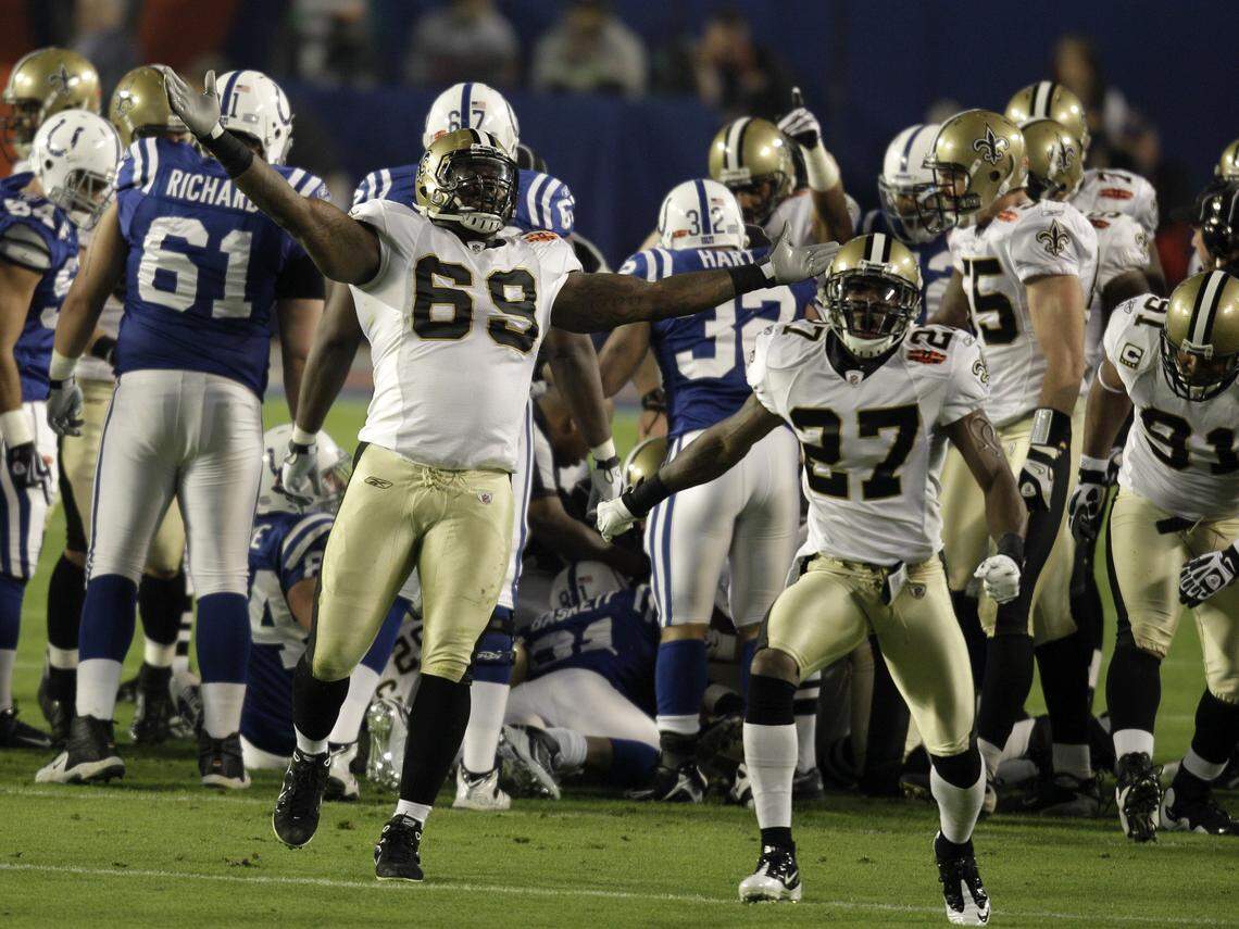 New Orleans Saints defensive end Anthony Hargrove (69) and Malcolm Jenkins (27) celebrate after they recovered an onside kick during the second half of the NFL Super Bowl XLIV football game against the Indianapolis Colts in Miami, Sunday, Feb. 7, 2010. (AP Photo/Chuck Burton)