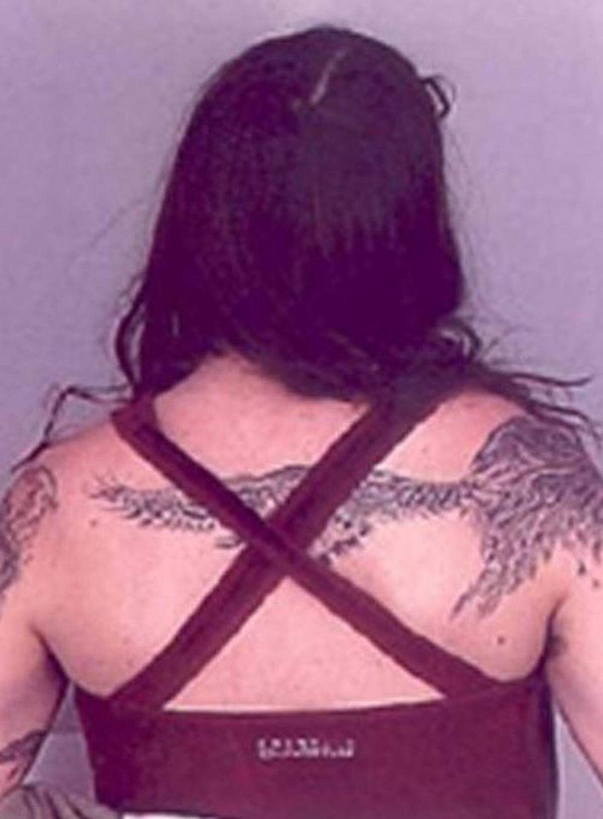 The tatted back of fugitive Josephine Sunshine Overaker