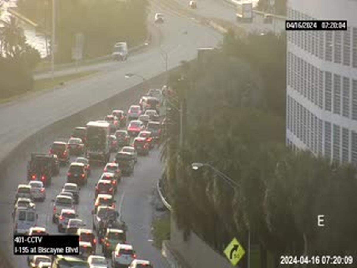 The traffic on the Interstate 195 spur route as it becomes the Julia Tuttle Causeway. The rollover crash is hidden by the building.