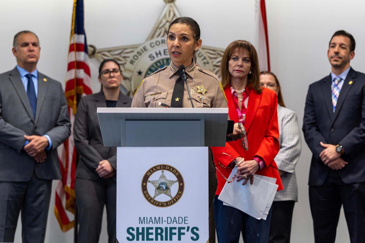 Sheriff Rosie Cordero-Stutz, center, speaks to the media during a press conference at the Miami-Dade Sheriff’s Office HQ in Doral, Florida, on Wednesday, March 12, 2025. The Sheriff disclosed details of a public corruption investigation that resulted in arrests of two health inspectors on public corruption charges.