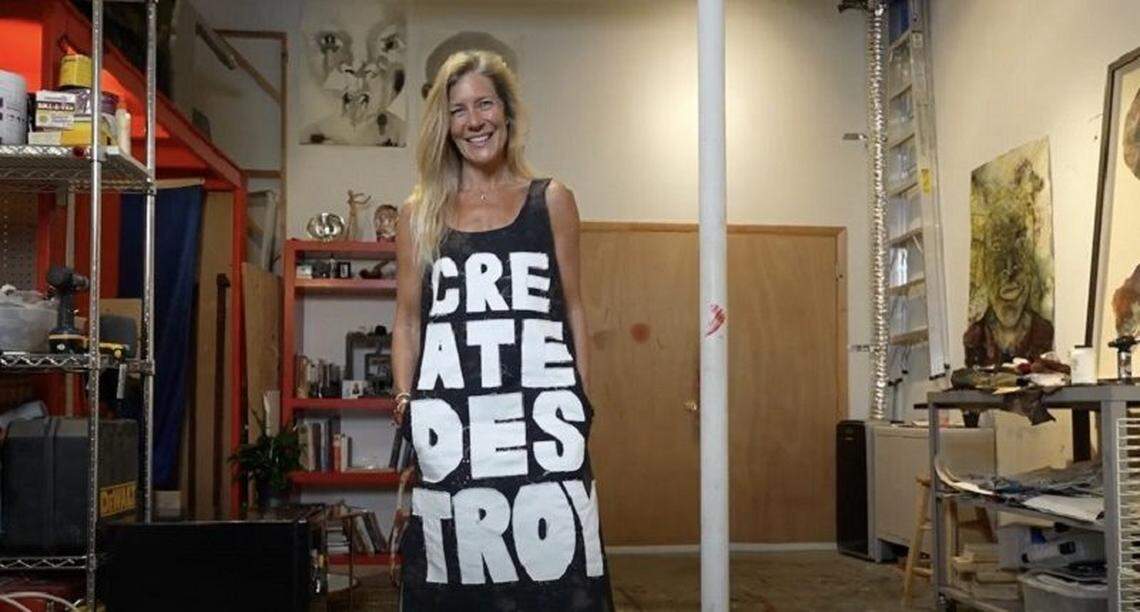 Artists Open founder Kathryn Mikesell wears a design by Fountainhead Studios artist Pangea Kali Virga while photographed in Stephen Arboite’s studio.