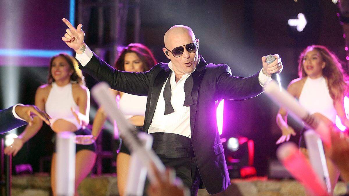 Pitbull, Mr. 305, performs in the 305 in November 2018 at the American Airlines Arena. The Miami rapper will have to share space with another area code handle when 645 joins 305 and 786 in Miami-Dade and the Keys on Aug. 4, 2023.
