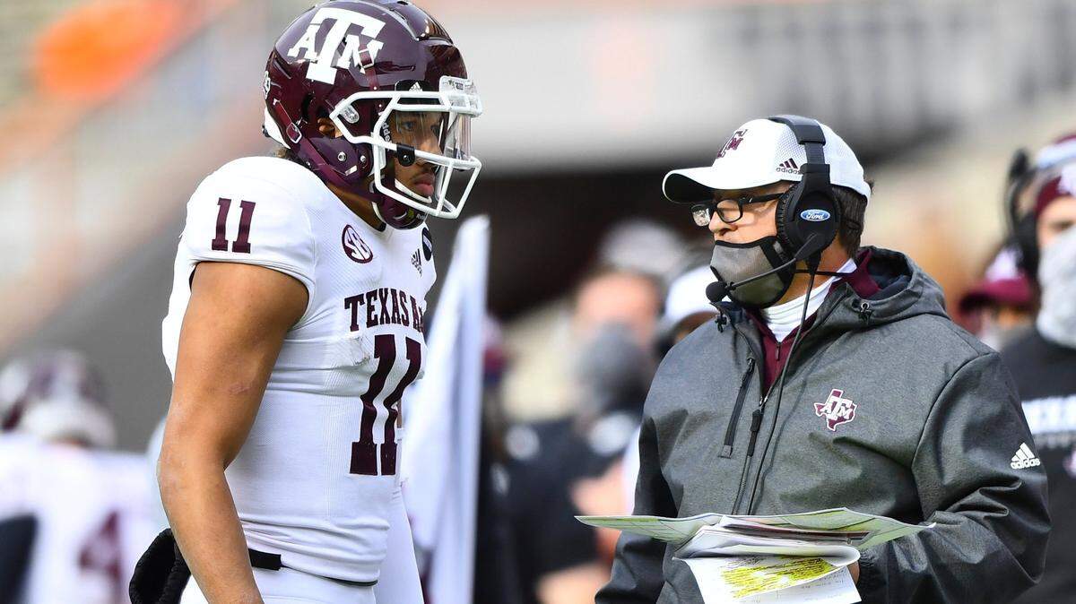 Texas A&M quarterback Kellen Mond (11) speaks to head coach Jimbo Fisher during an NCAA college football game against Tennessee in Neyland Stadium in Knoxville, Tenn., Saturday, Dec. 19, 2020. (Brianna Paciorka/Knoxville News Sentinel via AP, Pool)