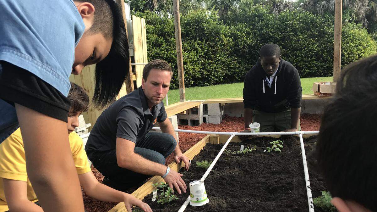 Students at Leewood K-8 Center in Kendall planted their first crops Oct. 9 in the new school garden. Encouraged by Corey Bousquet, owner of The Brick Miami, the young farmers also will learn how to harvest and cook the food they have grown themselves.