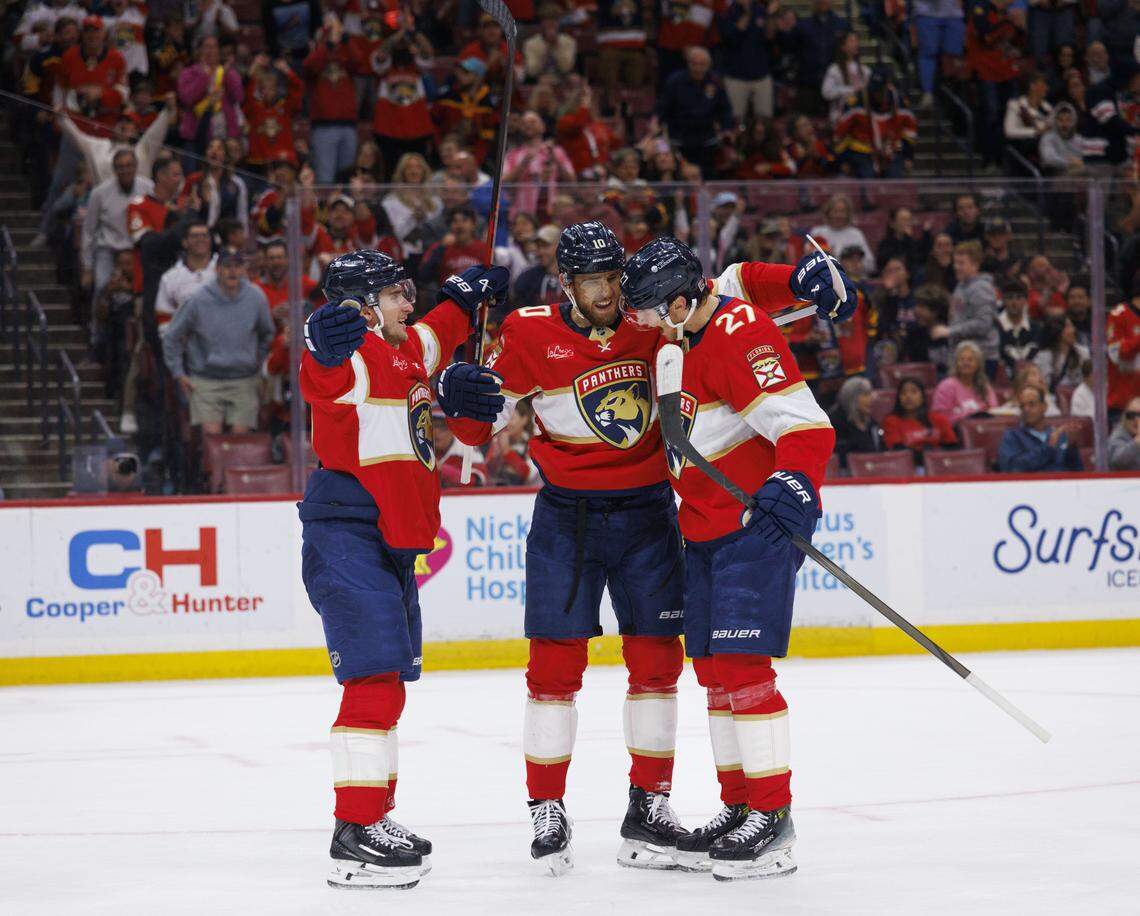 Florida Panthers left wing A.J. Greer (10) celebrate his goal with right wing MacKie Samoskevich (11) and center Eetu Luostarinen (27) celebrates during the first period of a game against the Ottawa Senators on Florida Panthers Pride Night on Tuesday, March 31, 2026, at Amerant Bank Arena in Sunrise, Fla. The Florida Panthers scored 5 goals in the first period.