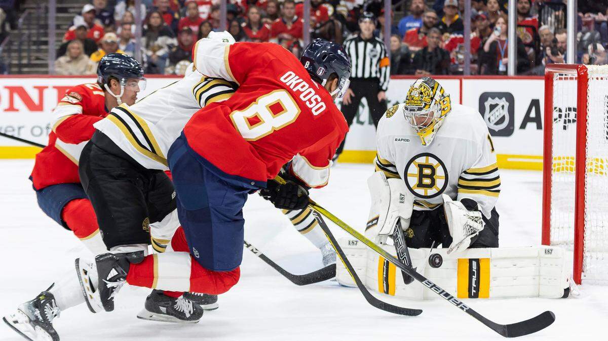 Boston Bruins goaltender Jeremy Swayman (1) blocks a shot by Florida Panthers right wing Kyle Okposo (8) in the second period of Game 1 of the second-round series of the Stanley Cup Playoffs on Monday, May 6, 2024, in Sunrise, Fla.
