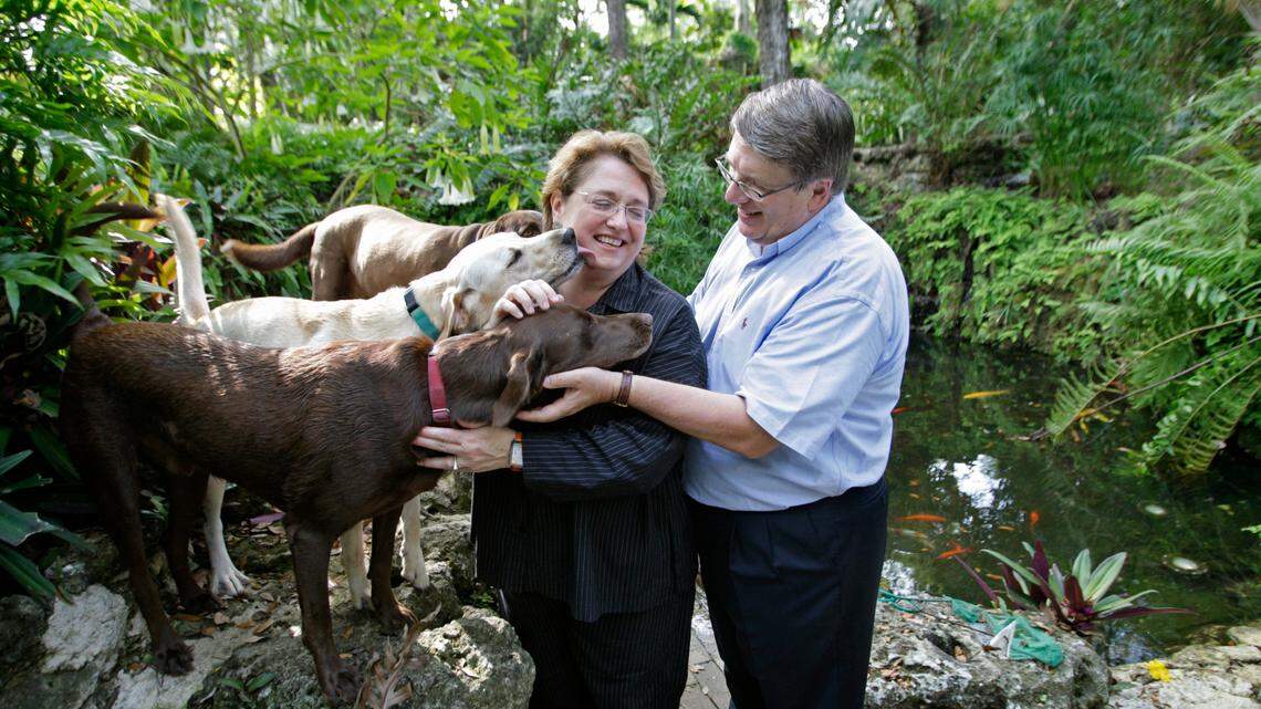 3-12-08 AL DIAZ / MIAMI HERALD -- In this 2008 Miami Herald file photo, Margaret Pericak-Vance, Ph.D., and Dr. Jeff Vance are genetic researchers at UM who head the Miami Institute for Human Genomics. Here they are in their grotto at home with their dogs, front to back, Bakon, Gravee and Gritz. Today, Pericak-Vance is leading an international study that will recruit ​up to 13,000 people of African and Hispanic ancestry to study Alzheimer’s disease. .AL DIAZ / MIAMI HERALD.