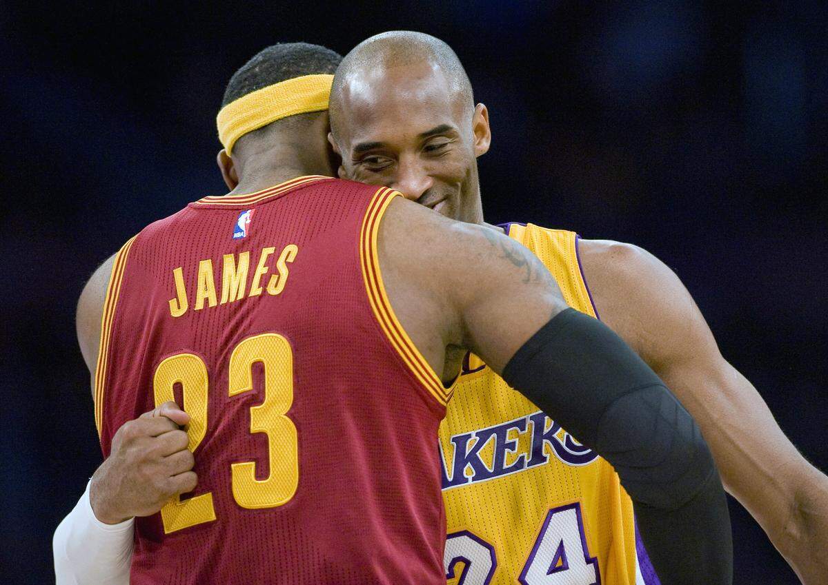 Los Angeles Lakers guard Kobe Bryant, right, and Cleveland Cavaliers forward LeBron James hug before the start of an NBA basketball game, in Los Angeles. The Los Angeles Lakers have a new superstar — L.A.-Bron. The four-time NBA MVP announced Sunday night, July 1, 2018, that he has agreed to a four-year, $154 million contract with the Lakers. "Welcome to the family (at)KingJames," Bryant said on Twitter . "(hash)lakers4life (hash)striveforgreatness."