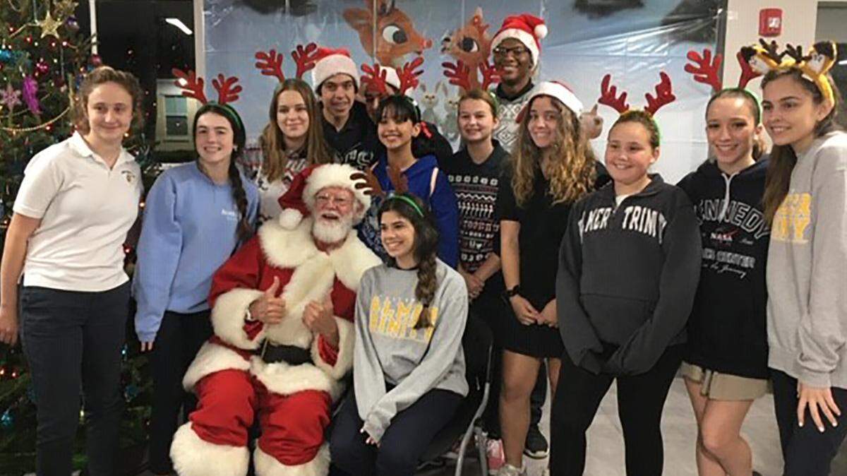 Palmer Trinity School’s PTS Cares Club members recently visited more than 250 residents at Chapman Partnership’s South Family Resource Center in Homestead for the holidays. From left, volunteers Isabella Fratangelo, Isa Tao, Sofia Naziazeni, Ismael Alvarez, Elena Morin, Sara Aparicio, Lulu Infante, Claire Almeida, Carla Lombardo, Felicity Franklin, and Federica Negron. 
