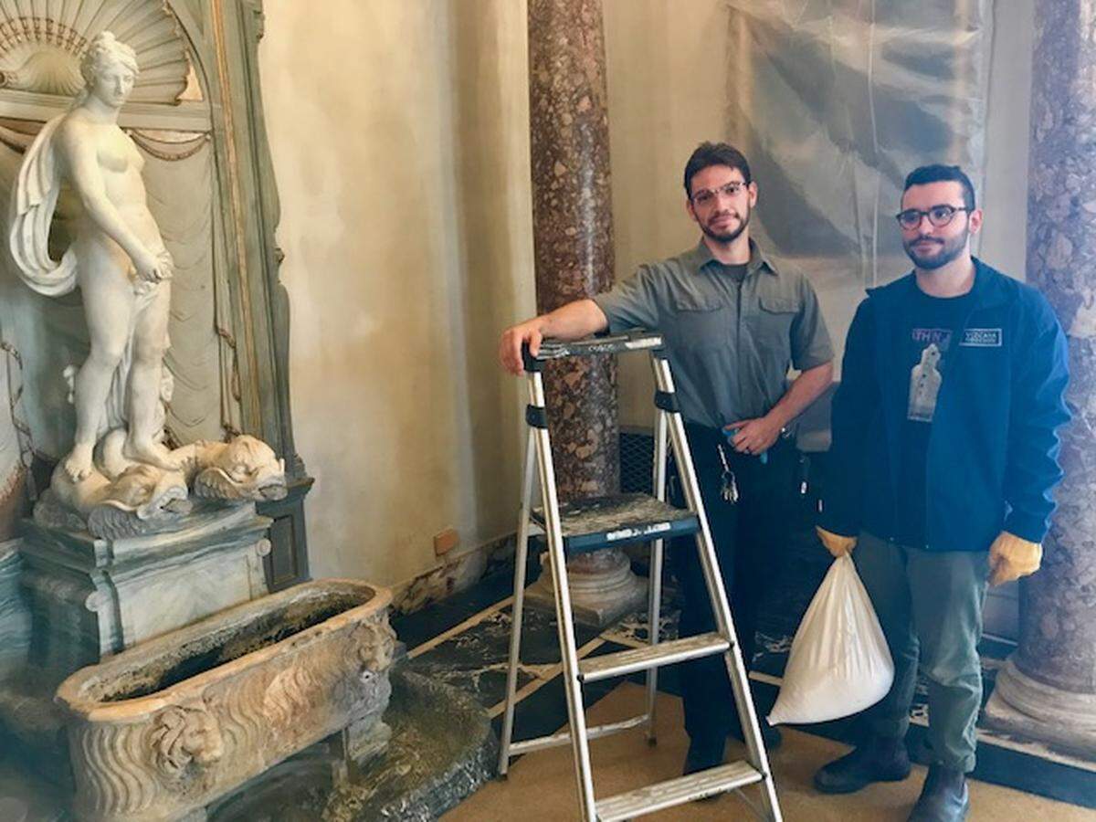 At Vizcaya Museum and Gardens, Marvin Mora, left, and David Miller take protective measures in the Dining Room as the staff braces for Hurricane Dorian.