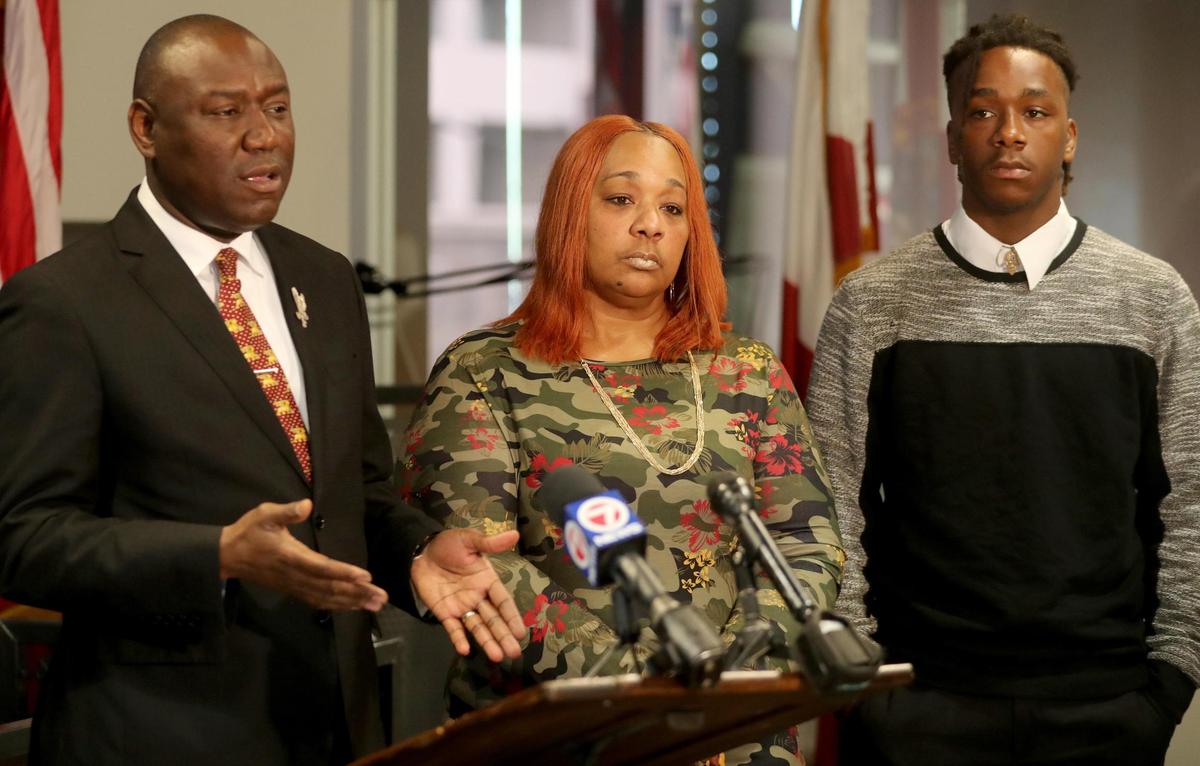 Civil rights attorney Ben Crump, Angela Cross and her son Cyrus Nance talk with the media about a possible case against American Heritage High school for discriminating against Nance and expelling him without due process.