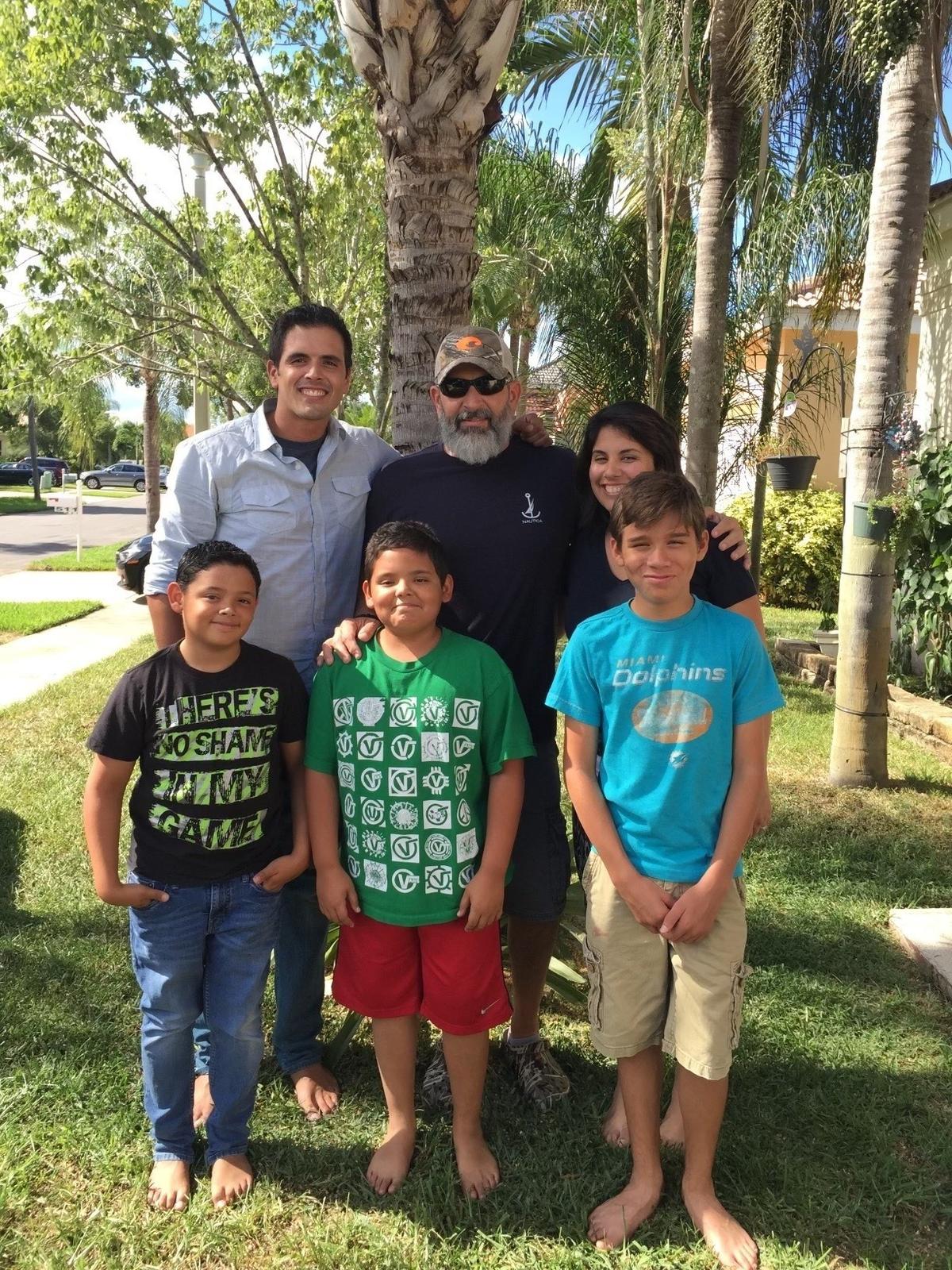 Joel García, center, top row, poses with his five children in a 2015 photo. Top row, from left: Chris, Joel, Isabel. Bottom row: From left: Jonah, Jay and Abel. Joel died in 2019 after his family waited more than 20 minutes for paramedics to arrive from Miami Lakes as Hialeah Heights does not have a fire rescue unit.