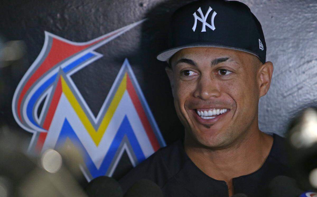 New York Yankees outfielder Giancarlo Stanton talks to the media before the start of a Major League Baseball interleague game against the Miami Marlins at Marlins Park on Tuesday, August 21, 2018.