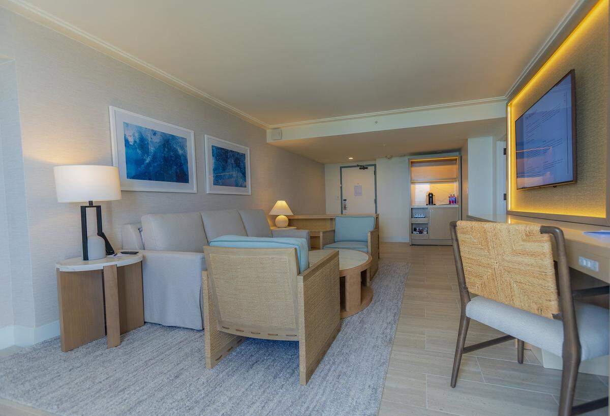 A redesigned living room area of a guestroom at the Loews Miami Beach.