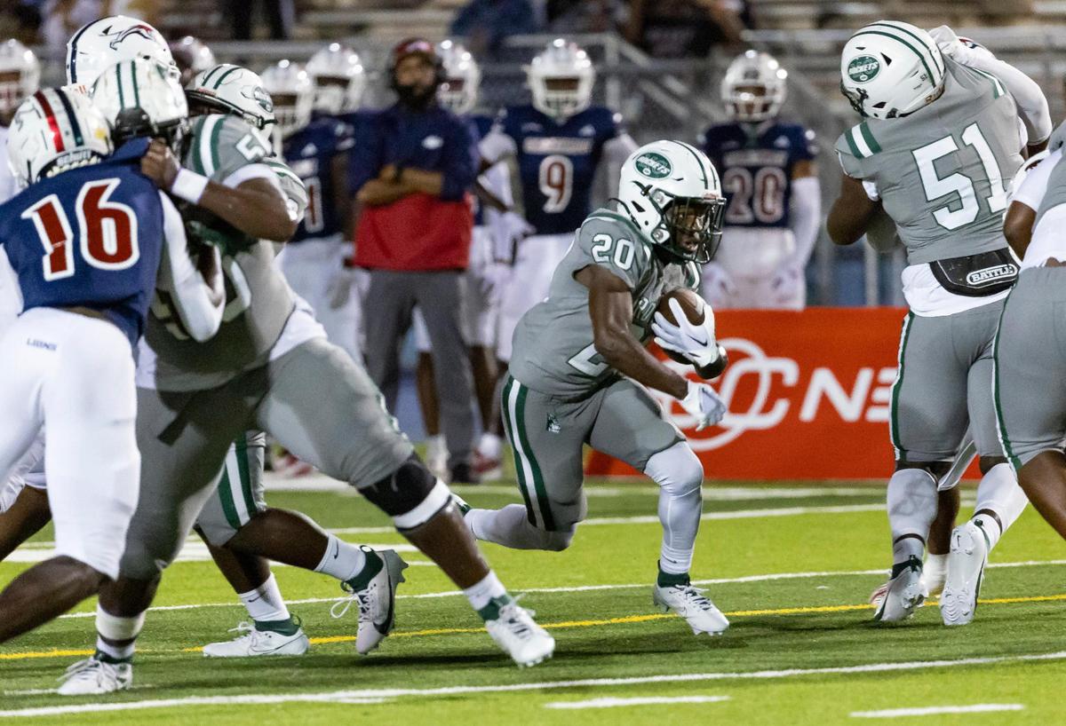 Central Rockets running back Jayden Ford (20) runs with the ball against the Chaminade-Madonna Lions in the first quarter of their high school football game at the Nathaniel Traz Powell Stadium on Thursday, Sept. 21, 2023, in Miami, Fla.