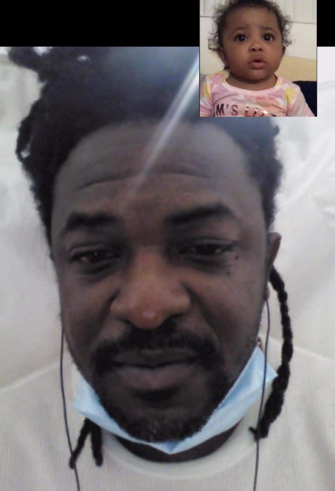 Jermaine Scott, a Jamaican national who tested positive for COVID in ICE custody, video chatting with his 10-month-old daughter.