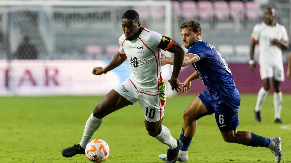 Martinique forward Brighton Labeau (10) dribbles with the ball as Puerto Rico midfielder Juan O’Niell (6) chases behind in the first half of their CONCACAF Gold Cup 2023 preliminary match at DRV PNK Stadium on Tuesday, June 20, 2023, in Fort Lauderdale, Fla.