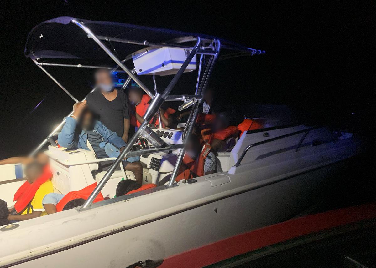 Pictured are 23 illegal migrants and two suspected smugglers on a 25-foot pleasure craft approximately 10 miles east of Palm Beach, Florida, Oct. 09, 2020. Coast Guard and&nbsp;Customs and Border Protection Air and Marine Operations interdicted 23 illegal Haitian migrants and two Bahamian suspected smugglers, repatriated the migrants and transferred the suspected smugglers to CBP. Coast Guard Photo by Petty Officer 3rd Class Matthew Huber.
