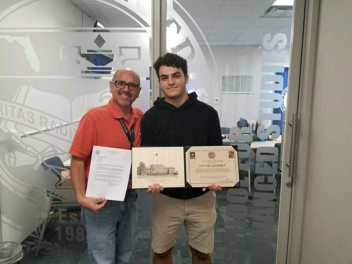 Victor Ramirez of the School for Advanced Studies, right, was named a recipient of the Army Reserve Officer Training Corps Scholarship to Duke, Carnegie Mellon, and Princeton universities. He stands with his counselor, Jose Fraga.