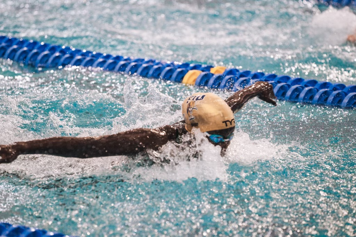 Junior swimmer Oumy Diop races for the FIU swimming and diving team.