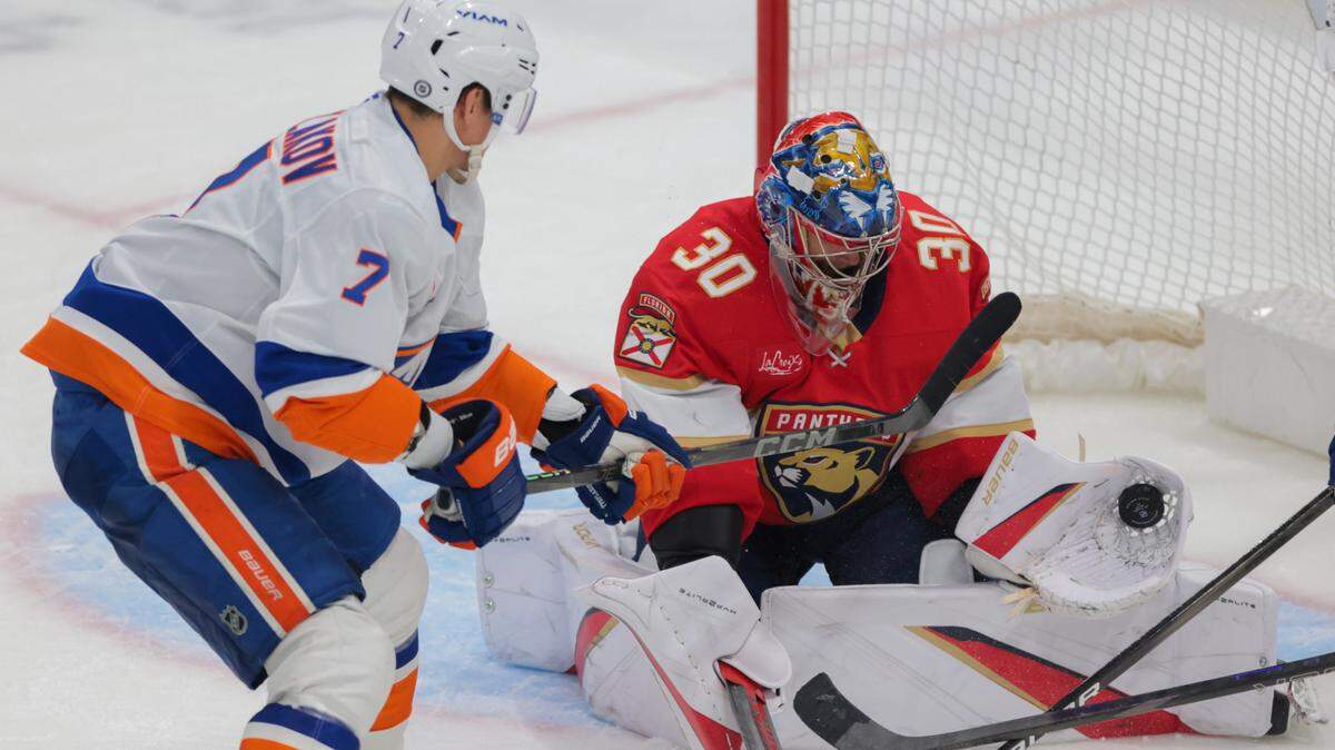 Feb 2, 2025; Sunrise, Florida, USA; Florida Panthers goaltender Spencer Knight (30) makes a save against New York Islanders right wing Maxim Tsyplakov (7) during the third period at Amerant Bank Arena. Mandatory Credit: Sam Navarro-Imagn Images