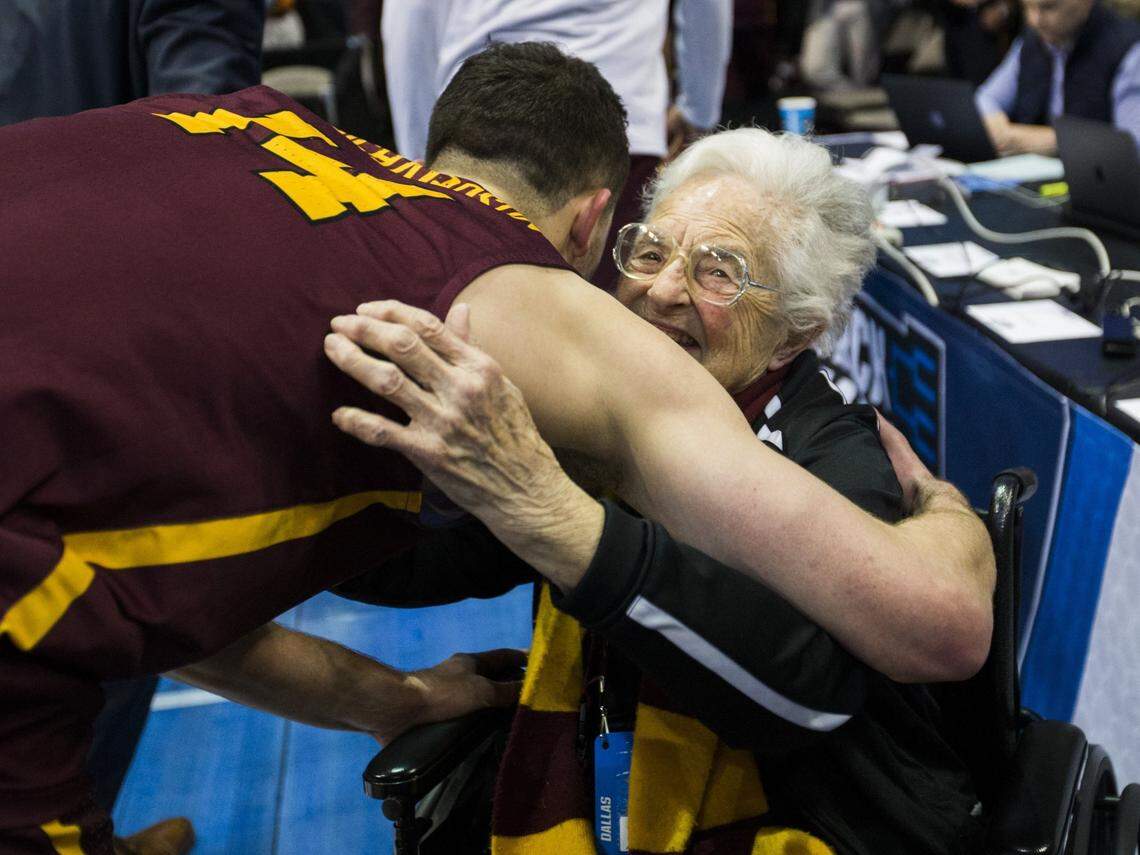 Sister Jean Dolores-Schmidt, a 98-year-old nun and Loyola Ramblers superfan, celebrates with the team on the court after a 64-62 win against Miami in the first round of the NCAA Tournament on March 15, 2018, at the American Airlines Center in Dallas. A last-second shot on Saturday, March 17, 2018, moves Loyola to the Sweet 16 with a 63-62 win against Tennessee. (Ashley Landis/Dallas Morning News/TNS)