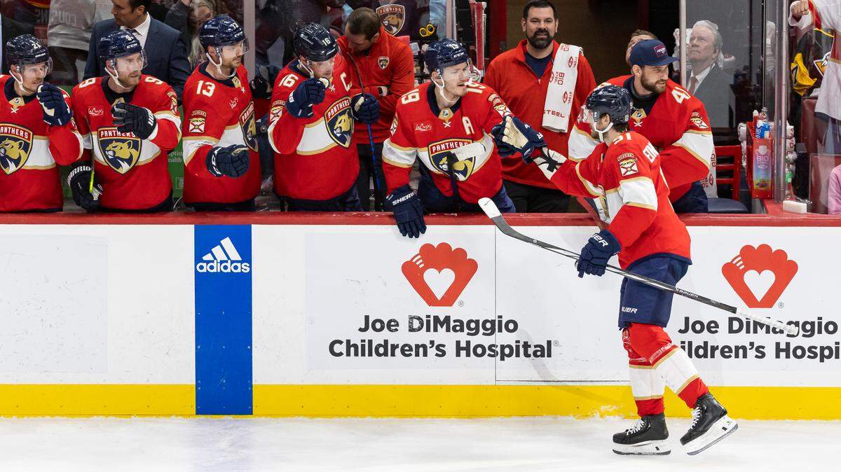 Florida Panthers defenseman Oliver Ekman-Larsson (91) celebrates with his teammates after scoring a goal against the Pittsburgh Penguins in the second period of their NHL game at the Amerant Bank Arena on Friday, Dec. 8, 2023, in Sunrise, Fla.