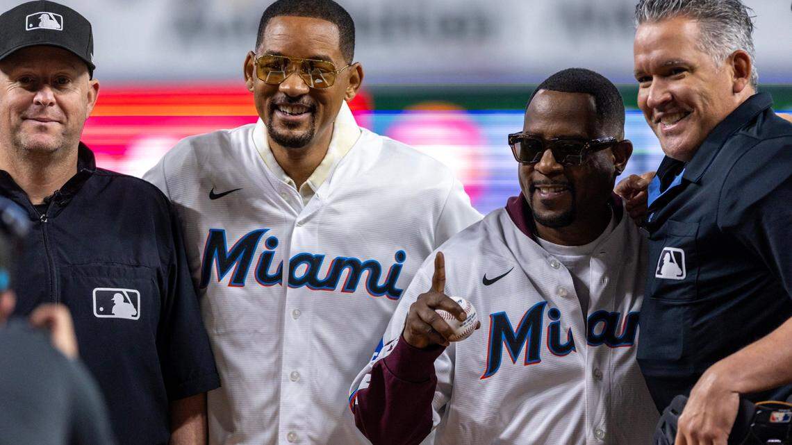 Actors Will Smith & Martin Lawrence, center, take a photo with MLB Umpires Manny Gonzalez, far right, and Todd Tichenor, far left, after throwing the first pitch before the first inning of an MLB game against the Tampa Rays at LoanDepot Park on Wednesday, June 5, 2024, in Miami, Fla. The actors were promoting their new film, Miami-based Bad Boys: Ride or Die.

