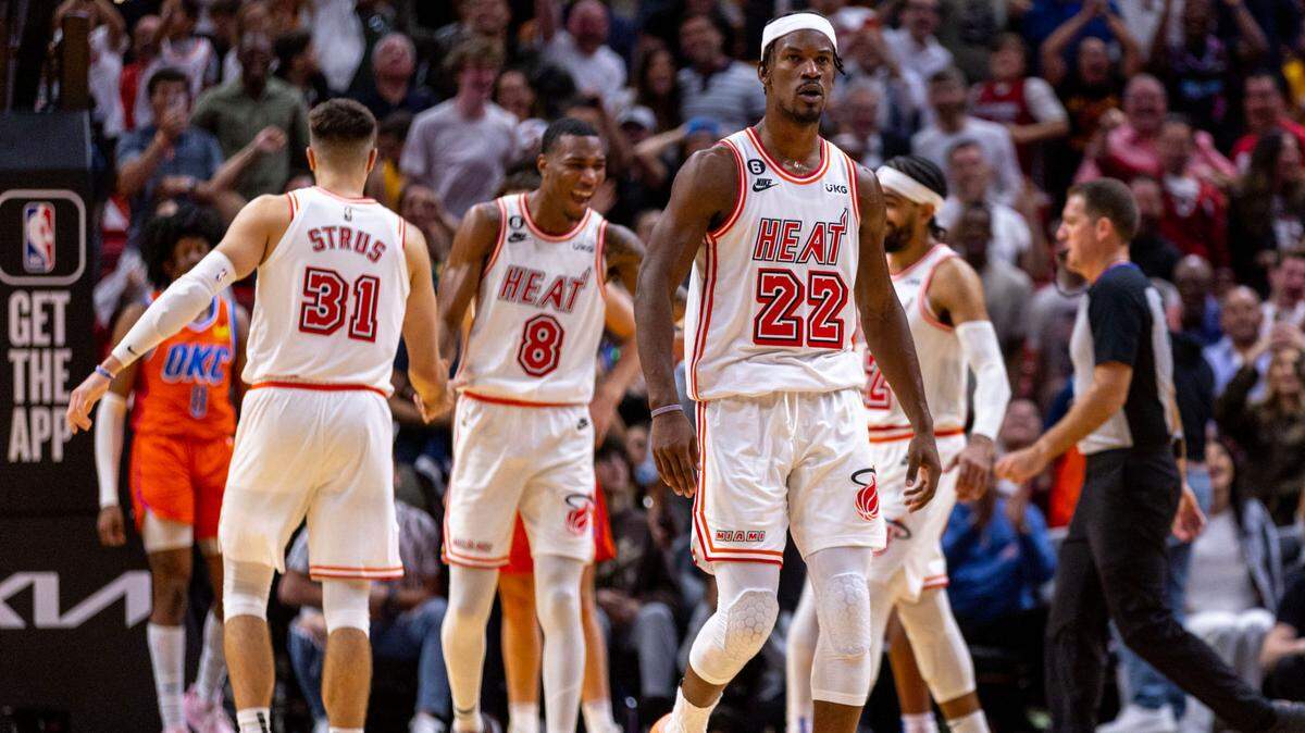 Miami Heat forward Jimmy Butler (22) reacts along with teammates after scoring late in the fourth quarter to put his team ahead during an NBA game against the Oklahoma Thunder at FTX Arena in Downtown Miami, Florida, on Tuesday, January 10, 2023.