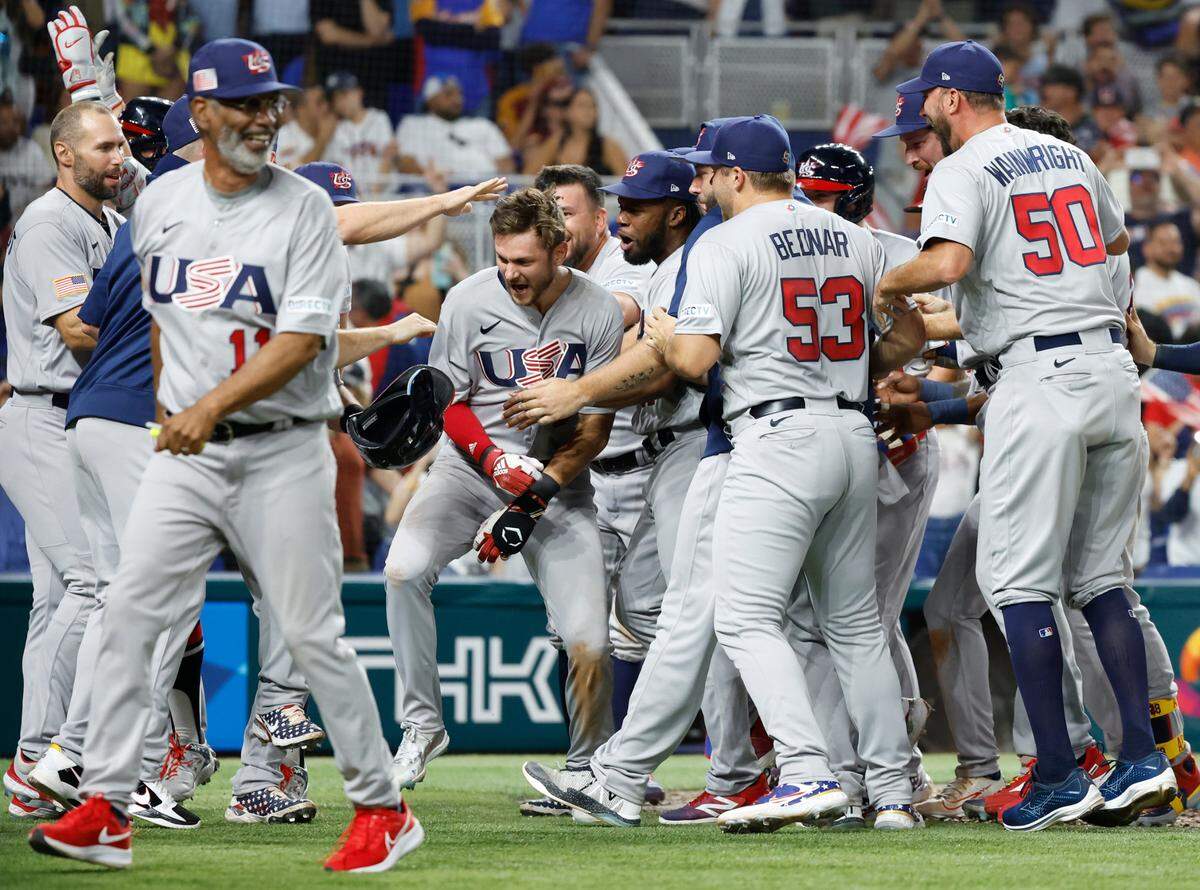 USA’s Trea Turner (8) celebrates with teammates after hitting a grand slam to left field. Tim Anderson scores, Bobby Witt Jr., and J.T. Realmuto score in the eighth inning during the game against Venezuela at the World Baseball Classic quarterfinal at loanDepot Park in Miami on Saturday, March 18, 2023. during the World Baseball Classic quarterfinal at loanDepot Park in Miami on Saturday, March 18, 2023.
