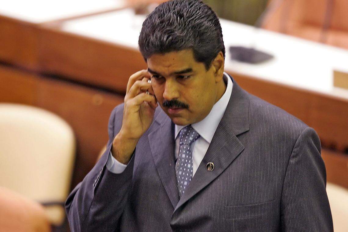 Venezuelan Foreign Minister Nicolas Maduro in 2006 speaks on a phone at a summit in Havana.
