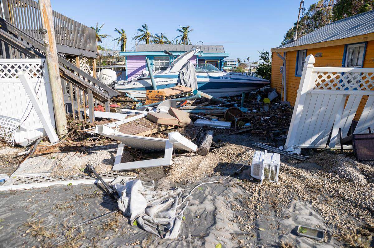 A damaged property is seen near a broken section of Pine Island Road on Thursday, Sept. 29, 2022, in Matlacha, Fla. Hurricane Ian made landfall on the coast of South West Florida as a category 4 storm Tuesday afternoon leaving areas affected with flooded streets, downed trees and scattered debris.