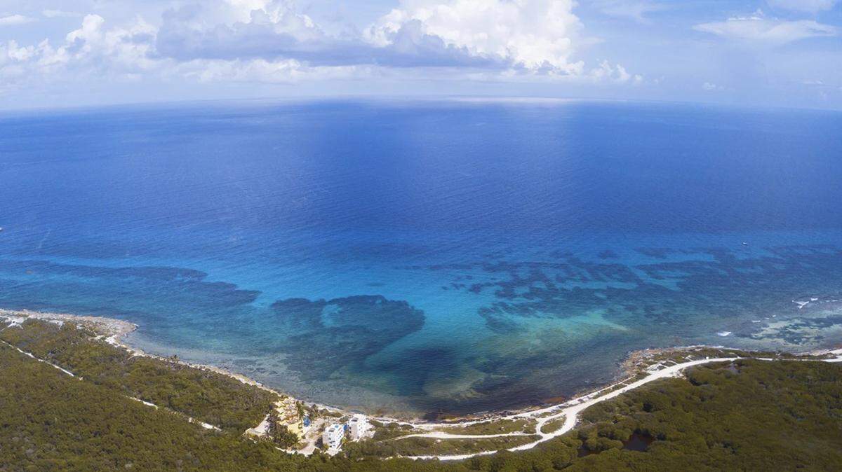 An aerial view of Mahahual shows the close relationship between the Caribbean Sea, coastal mangroves and the Mesoamerican Reef System. 