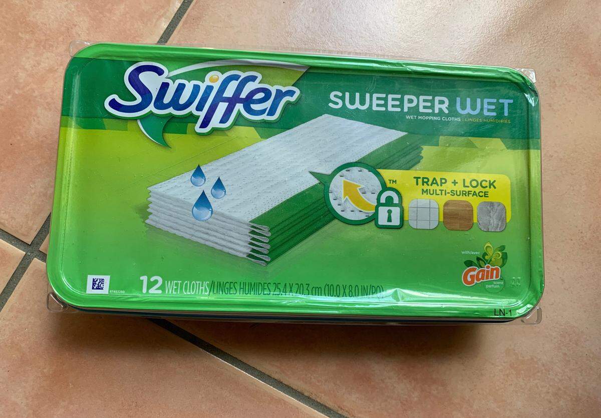 A Swiffer wet cloth product, manufactured by Procter & Gamble, promises to “Trap + Lock” dirt from floors.