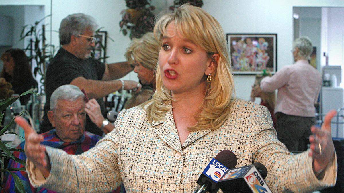 Tiffany Carr — shown during a 2004 visit to a Hollywood nail salon, where she spoke on domestic violence — announced Nov. 14, 2019, that she was stepping down as the CEO and president of the Florida Coalition Against Domestic Violence.