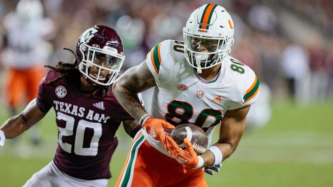 Miami Hurricanes tight end Elijah Arroyo (80) on a first down reception as Texas A&M Aggies defensive back Jardin Gilbert (20) gives chase in the second quarter at Kyle Field, Bryan College Station, Texas on Saturday, September 17, 2022.